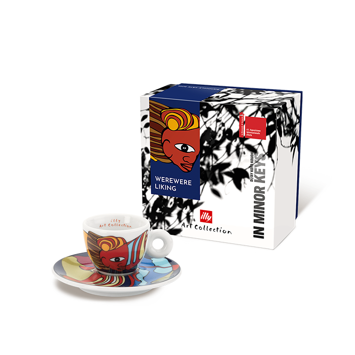 Colorful coffee cup and saucer set with a decorative box on a white background