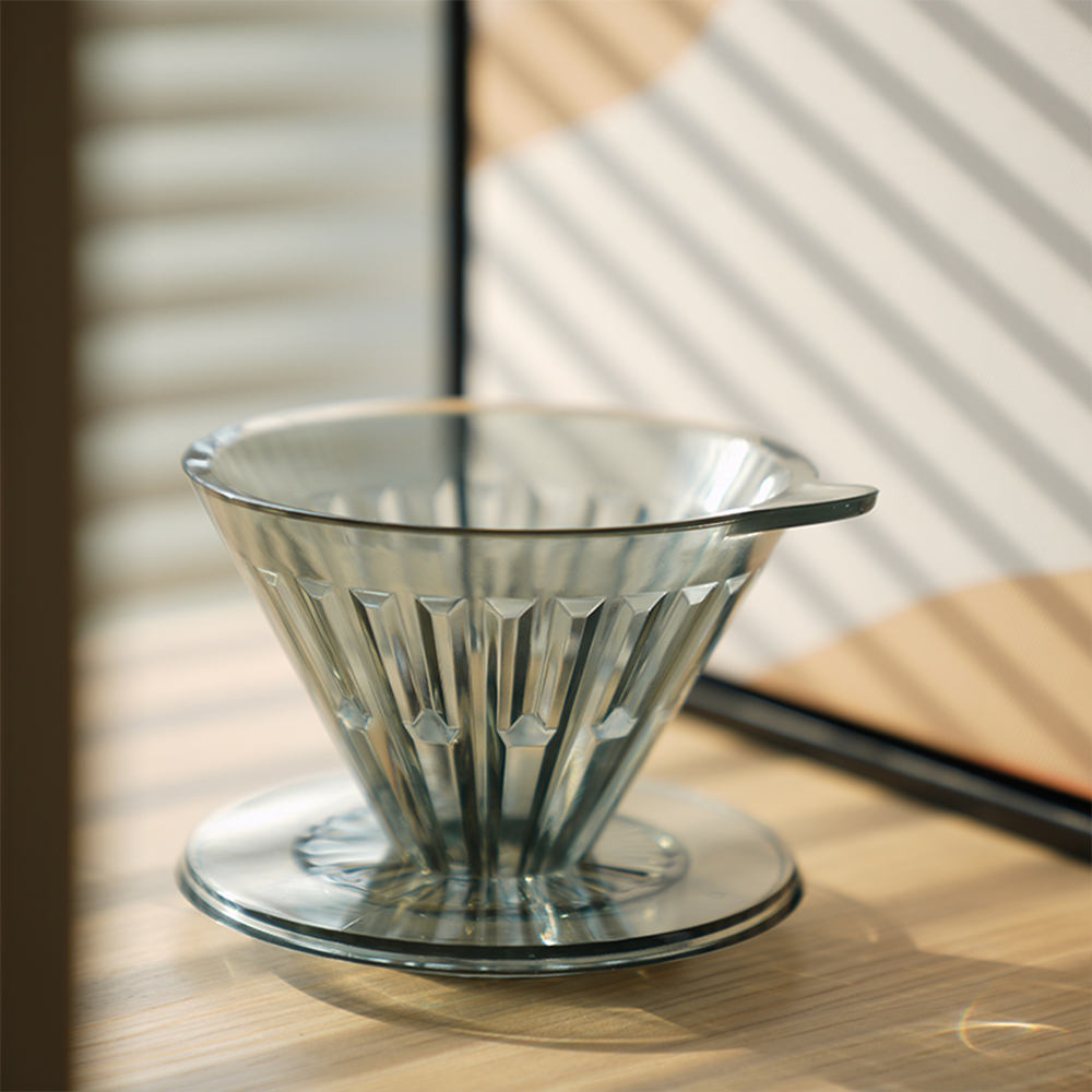 Overhead view into the transparent cone showing the drainage hole