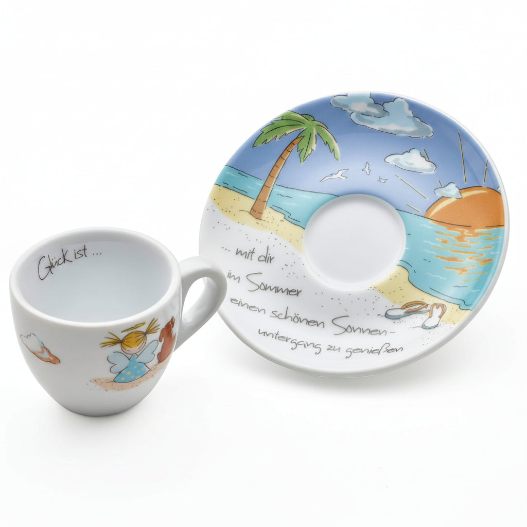 A white ceramic cup and matching saucer set with a whimsical summer landscape illustration and German text.