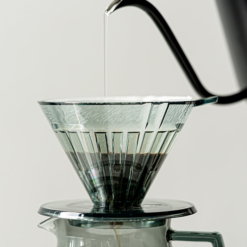 Turbo 01 in transparent black on a kitchen counter setup