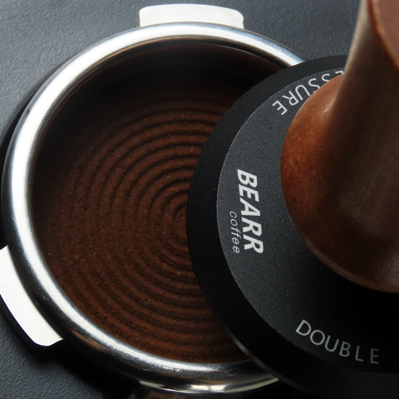 Close-up of the ripple pattern machined into the tamper base